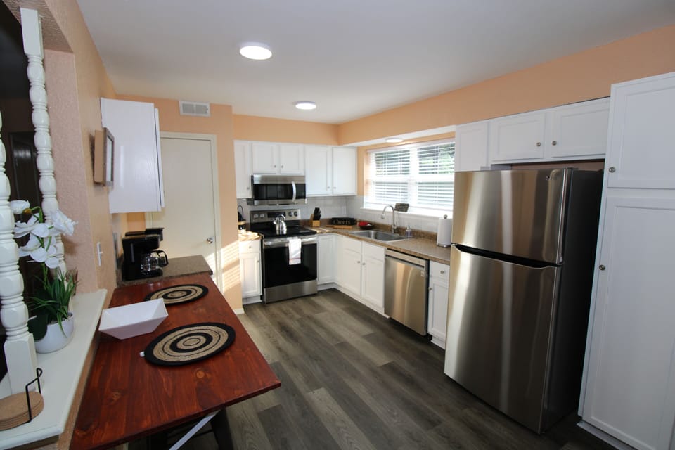 Kitchen with dining spot for 2 with stools