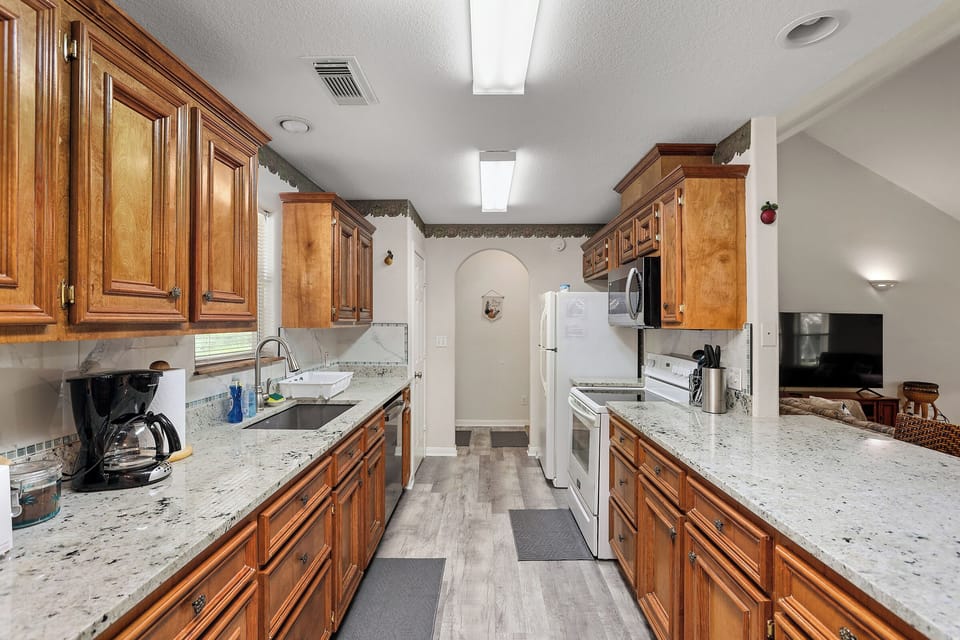 Large kitchen with granite countertop
