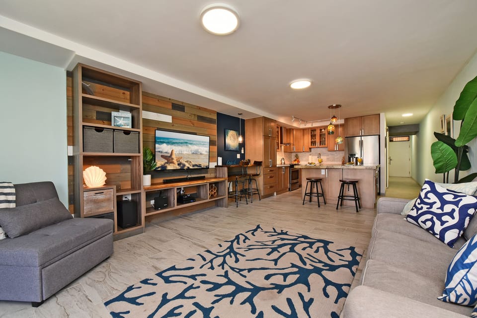 Luxury Condo | Living area | 80-inch Smart TV with cable channels, Hulu, streaming services