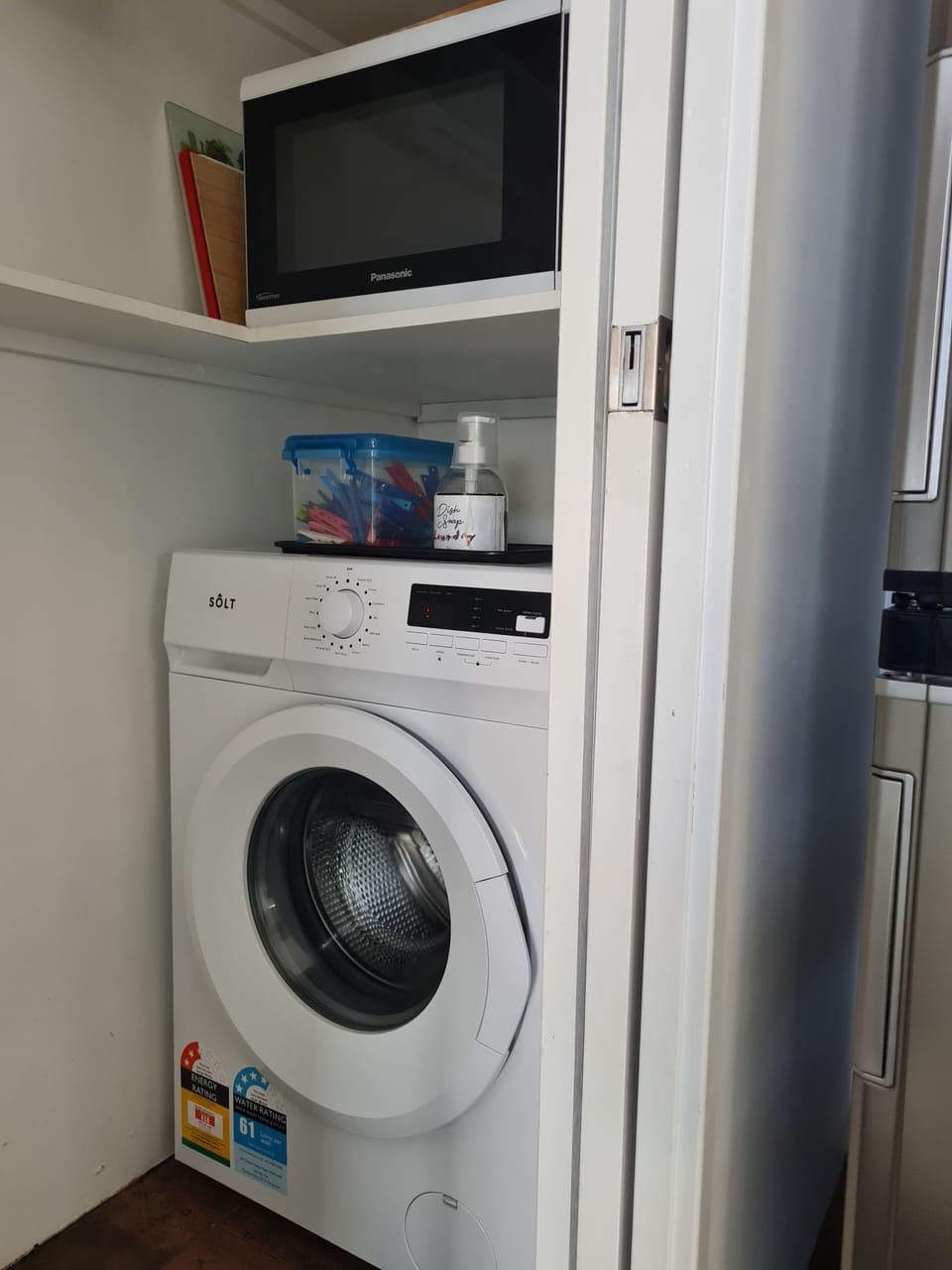 Washing machine in pantry.