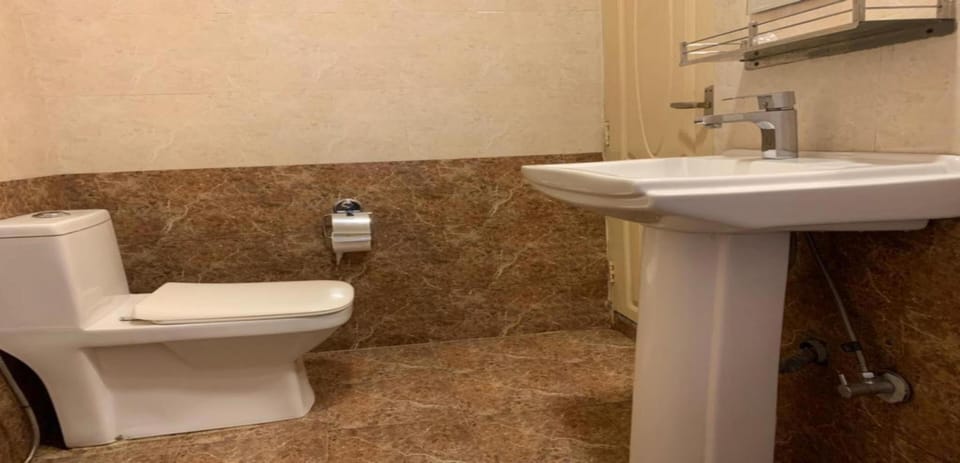 Shower, rainfall showerhead, towels, soap