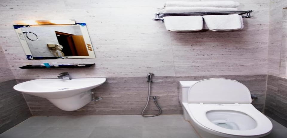Shower, rainfall showerhead, towels, soap