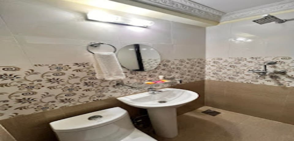 Shower, rainfall showerhead, towels, soap