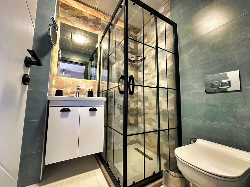 Junior Double Room, Garden View | Bathroom | Shower, hair dryer, slippers, towels