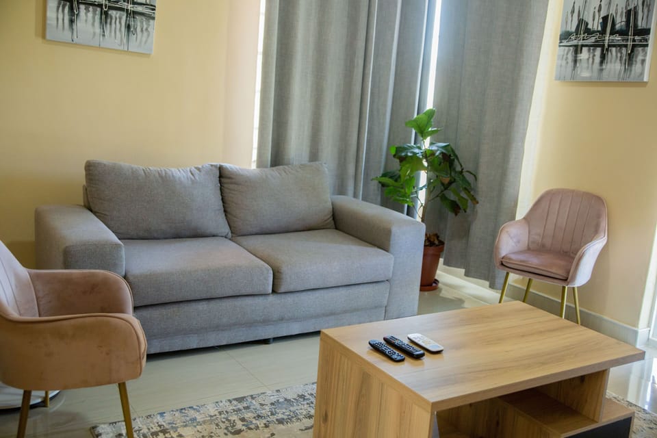 Executive Apartment | Living area | 40-inch plasma TV with satellite channels, TV