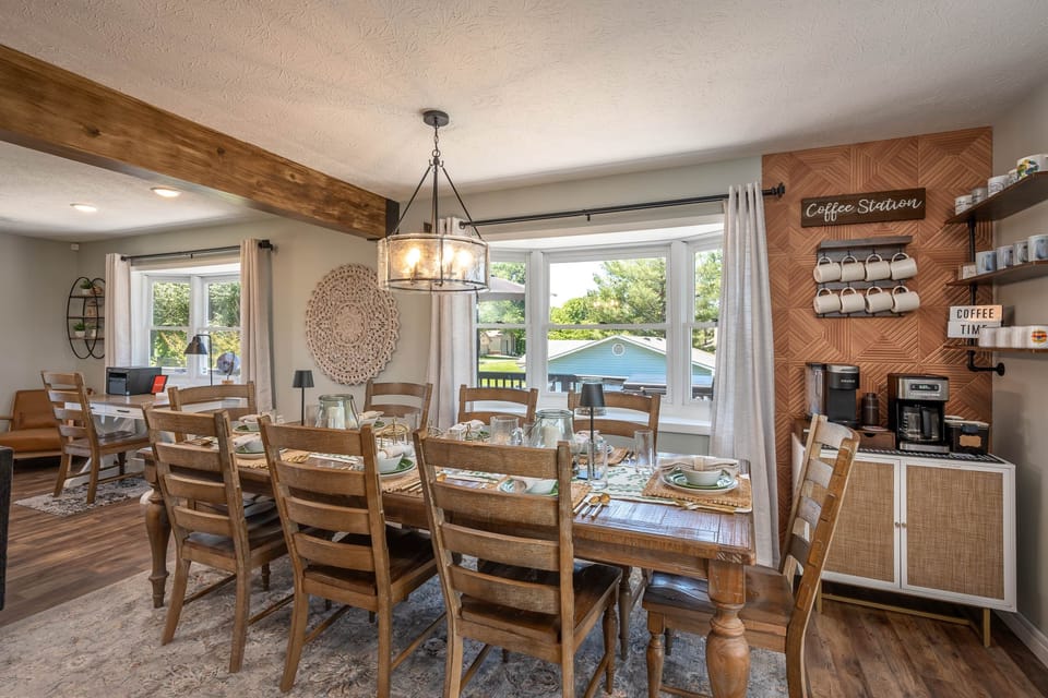 Large dining space with coffee station and gathering areas perfect for families and groups.