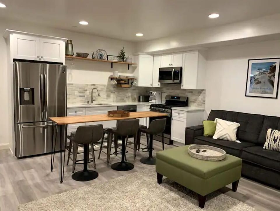 Kitchen with full size refrigerator | freezer, dishwasher & gas range/oven.

