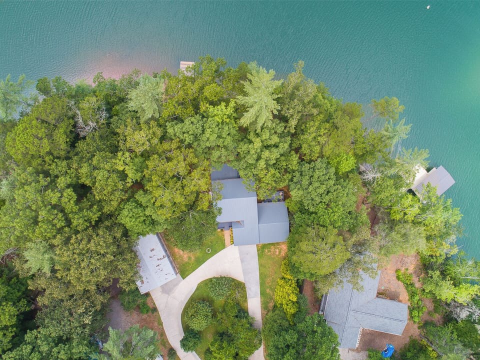 A private, peaceful retreat surrounded by trees & the lake is just a steps away.
