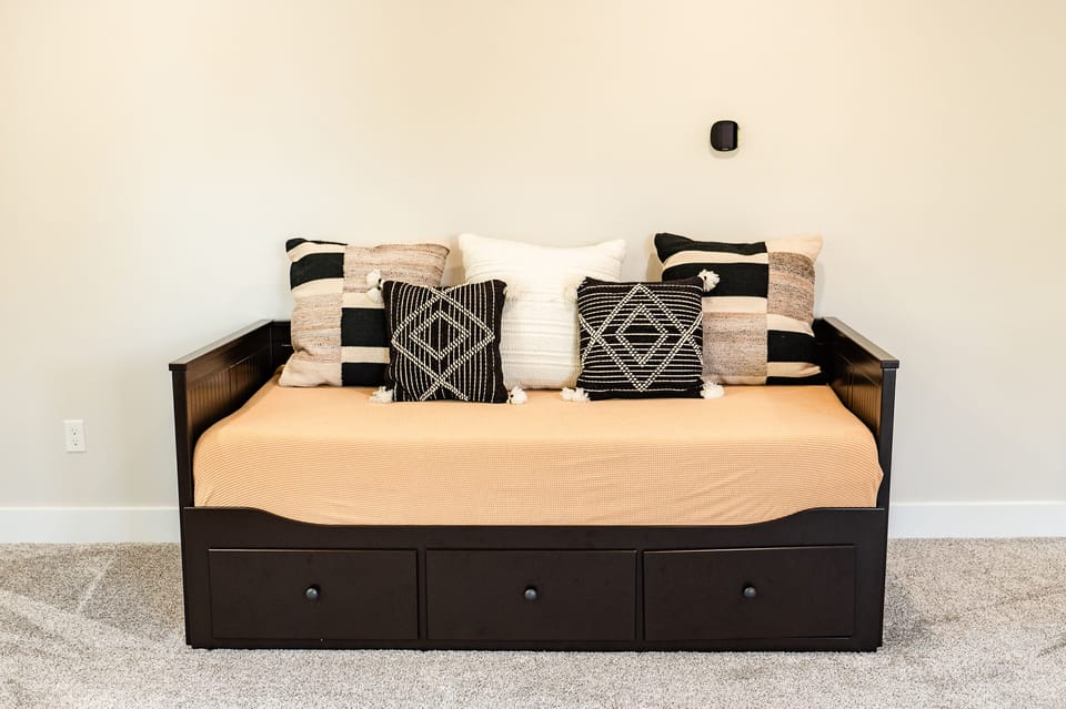 The daybed in the upstairs family room converts to a king bed or adjacent twins