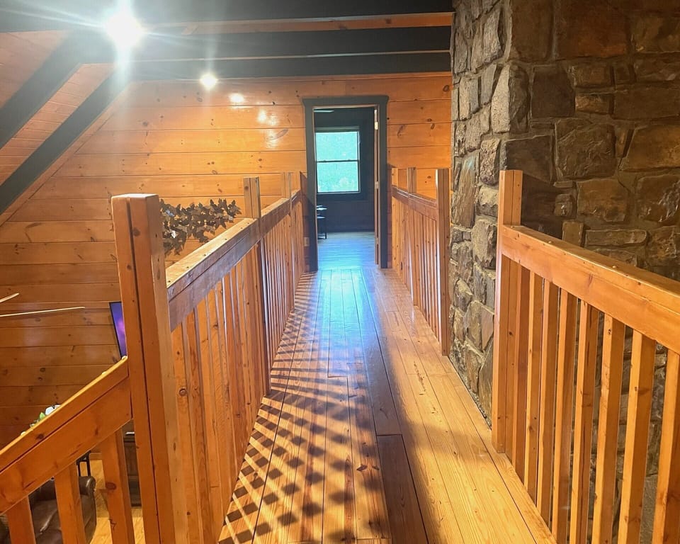 The catwalk not only takes you to the 4th bedroom, it also provides awesome views into the family room and kitchen.