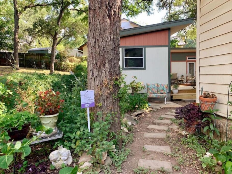Follow the stepping stones on the left side of our home to reach screen porch.