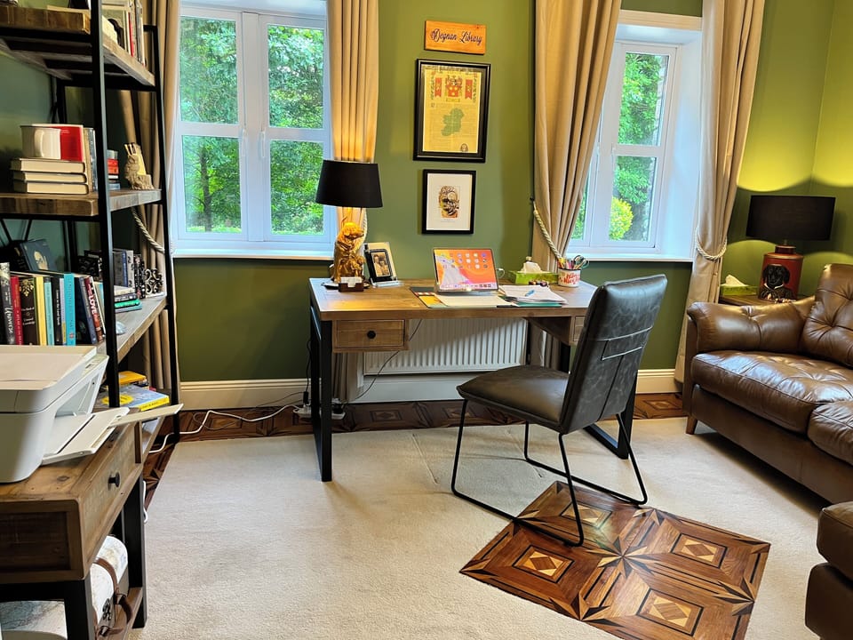 Degnan Library: desk, printer, leather couch with chaise