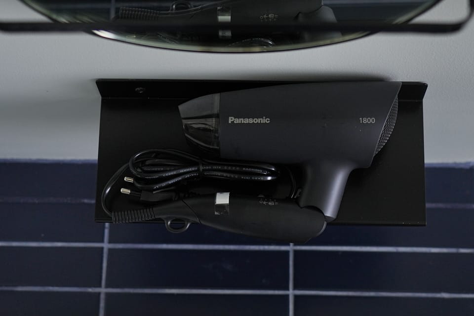 Shower, hydromassage showerhead, hair dryer, towels