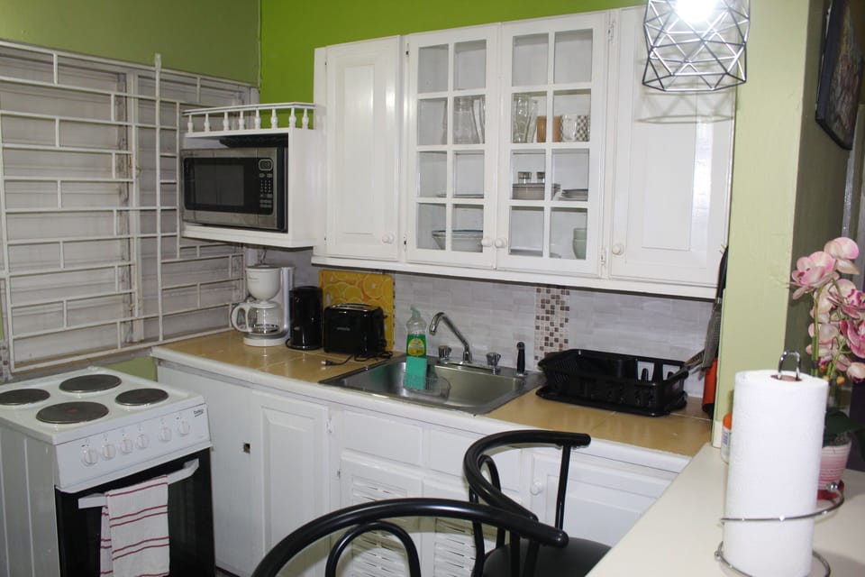 Fully-equipped kitchen with microwave, coffee maker, toaster and more