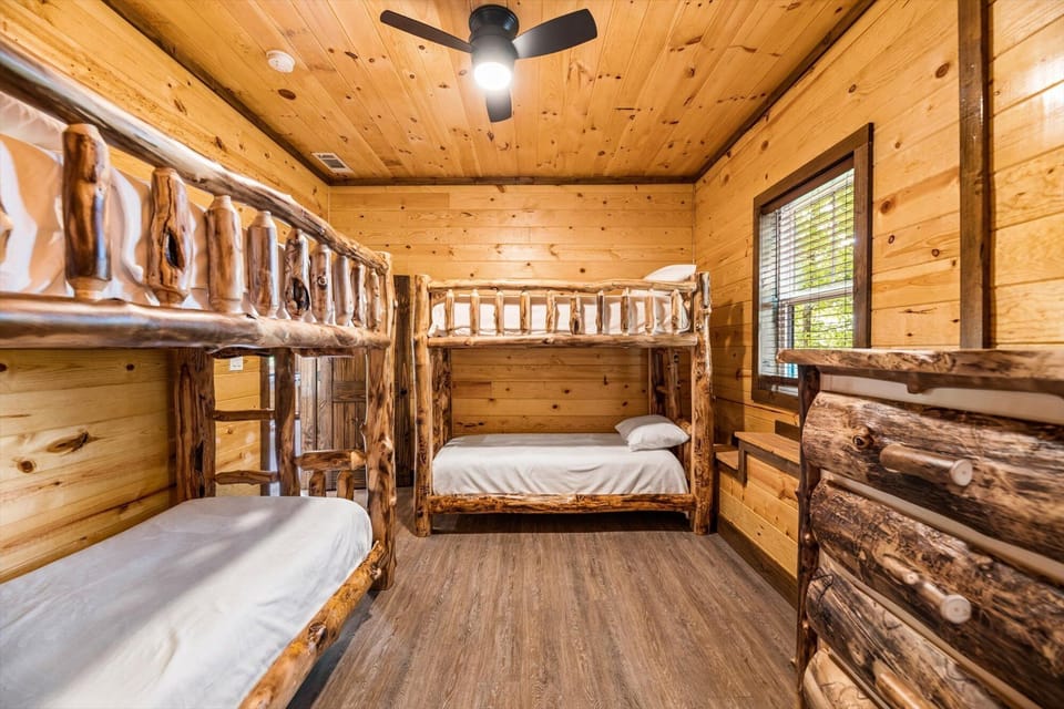 BASEMENT BUNKROOM FEATURING DUAL TWIN/TWIN BUNK BEDS