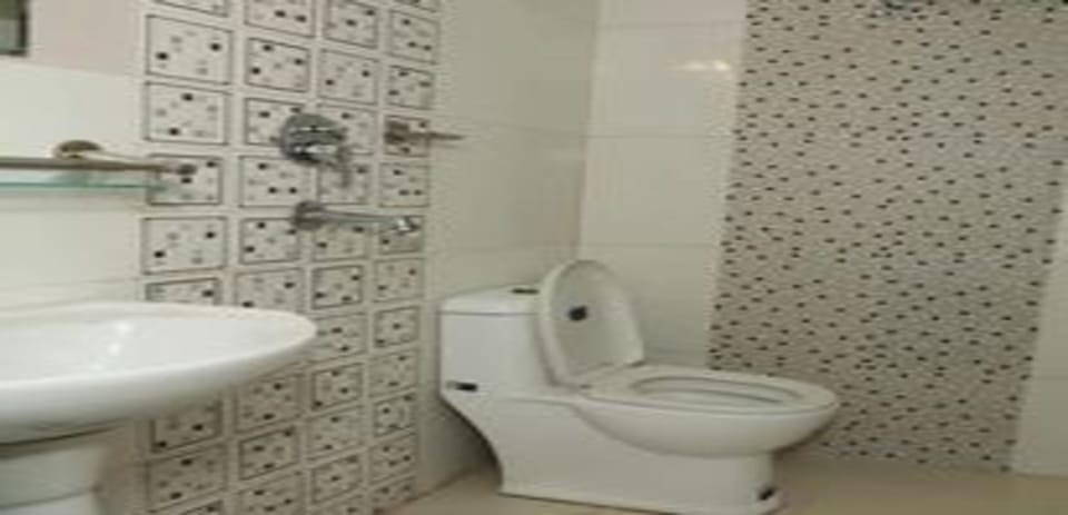 Shower, rainfall showerhead, towels, soap