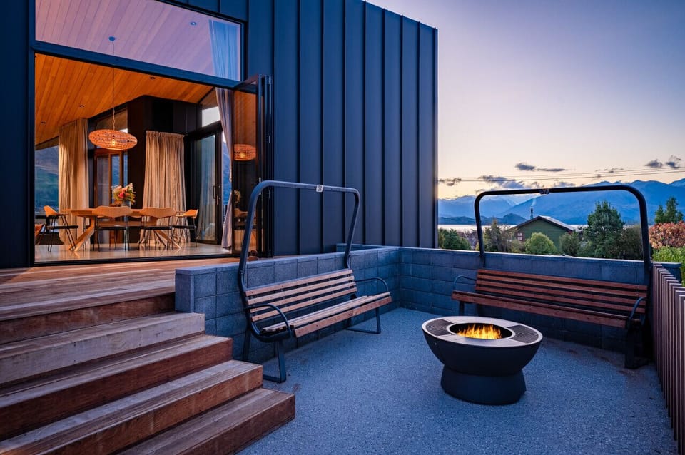 Outside area with ski lift chairs, and mountain views