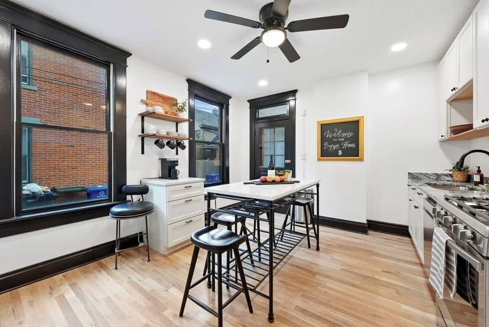 6 dining spaces in the kitchen at the island. 