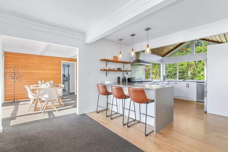 Open plan living connecting the kitchen, dining and living areas.