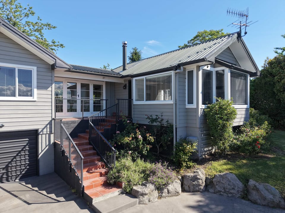 Exterior with plenty of parking in front of the house.