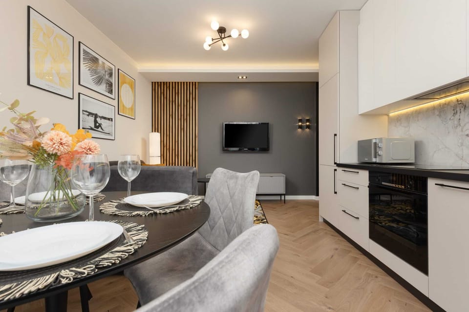 A different perspective of the living area which is harmoniously combined with the stylish kitchenette.