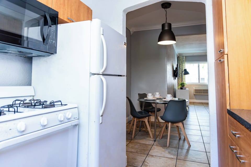 One Bedroom Double Queen Suite | Private kitchen | Full-size fridge, microwave, oven, stovetop