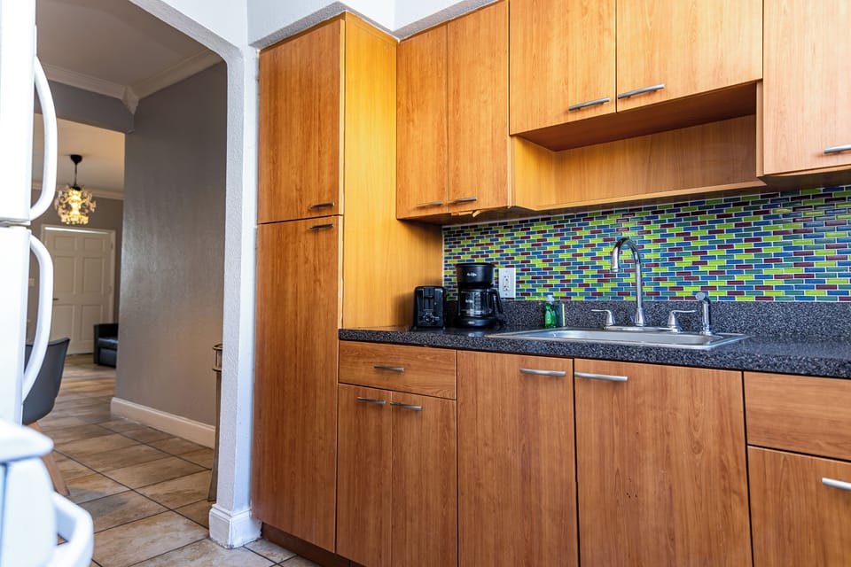 One Bedroom Double Queen Suite | Private kitchen | Full-size fridge, microwave, oven, stovetop