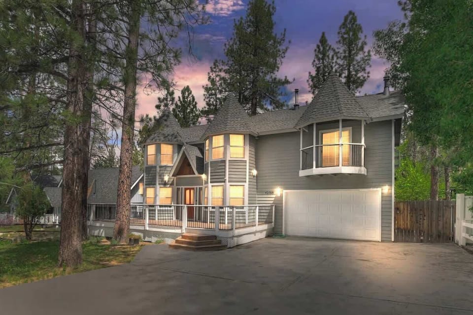 Front view of home with parking and garage. 