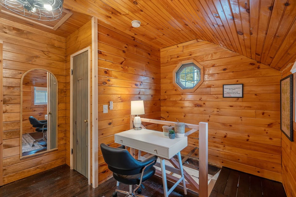 Upstairs has dedicated work area and full length mirror. 