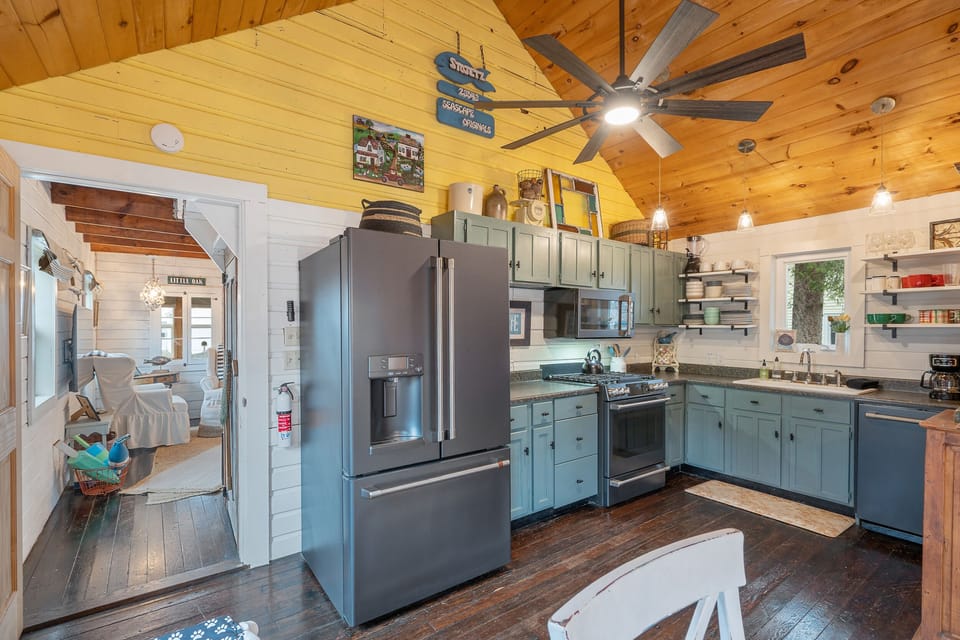 Kitchen off living room toward back of house.