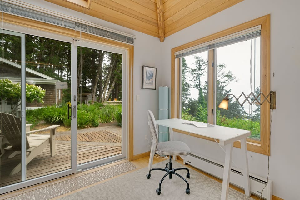 The living area on the main floor is open and expansive and offers a side reading room with desk and comfy chair, wood fireplace (wood not provided), comfortable sleeper sofa with lounge chair, Flat screen with cable TV,  and incredible ocean views.