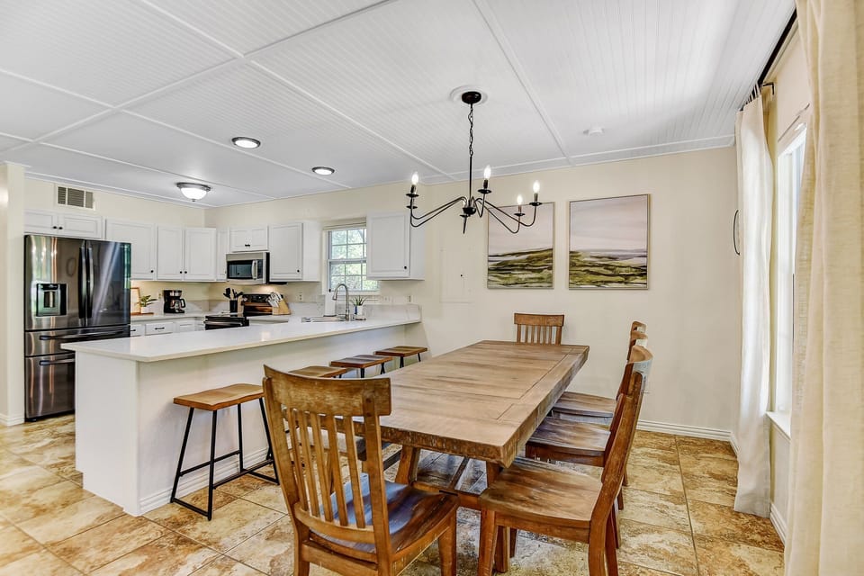 Large family dining table with seating for 8 and barstool for 4