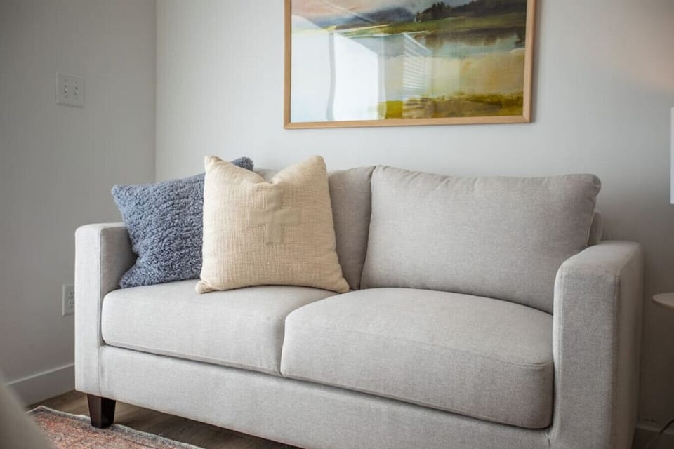 Studio with sofa and soft neutral tones