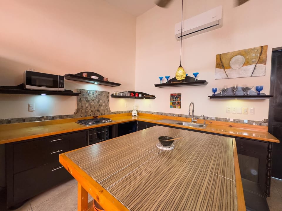 Spacious kitchen with vibrant island and modern amenities