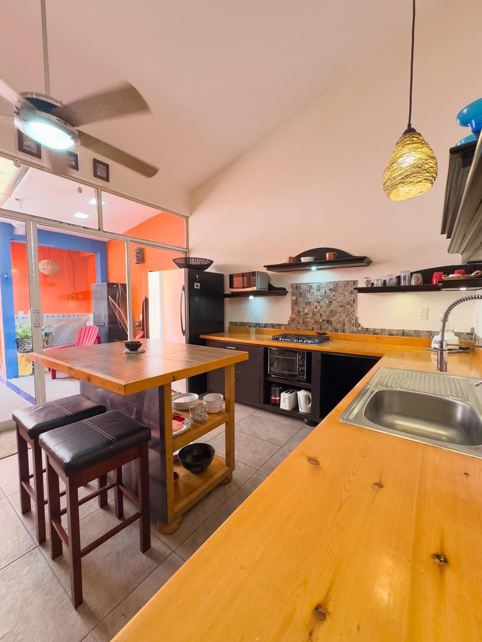 Cozy kitchen with vibrant art and natural light