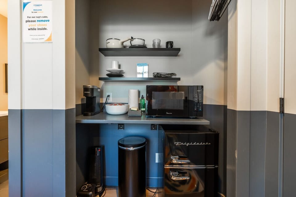 Kitchenette with microwave, coffee maker, and essentials