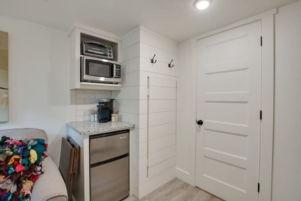 Cozy tiny cottage kitchenette stocked with essentials | prepare meals with ease, from morning coffee to dinner, perfect for couples or solo travelers seeking a relaxing nature escape