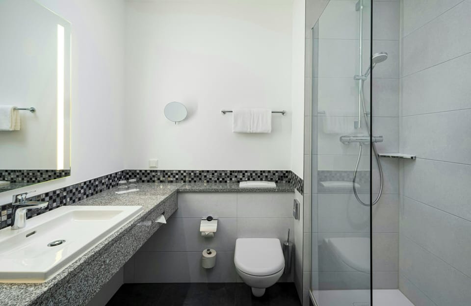Shower, eco-friendly toiletries, hair dryer, towels