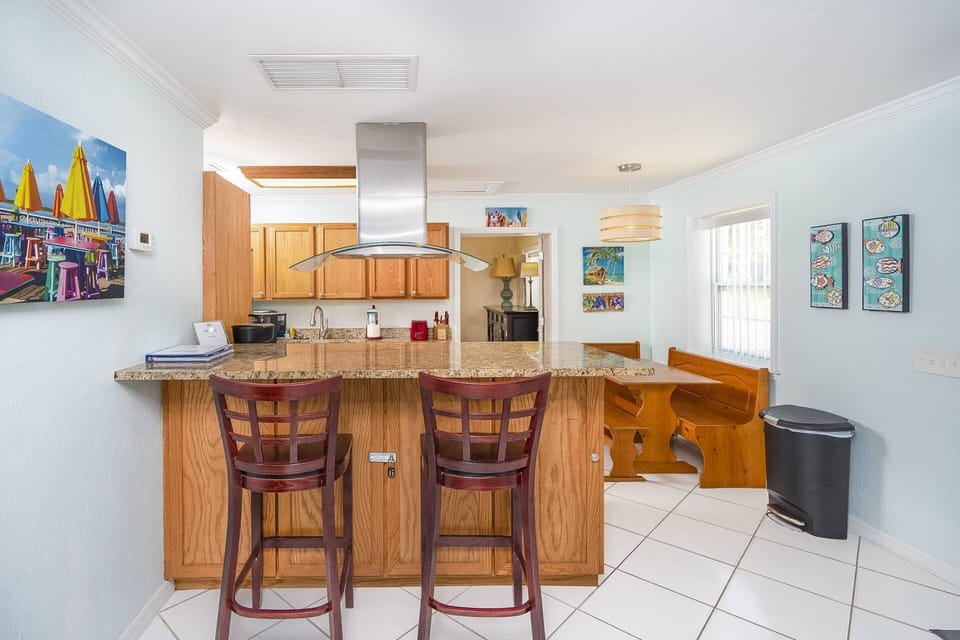 Enjoy delightful meals in our eat-in kitchen, complete with a breakfast bar the a perfect spot to gather for meals and plan your day's adventures.
