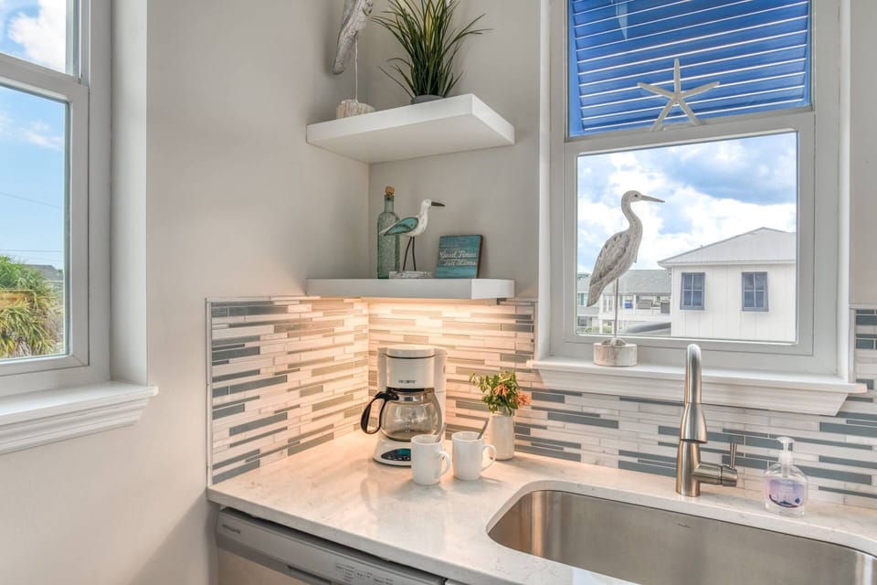 Embrace coastal charm with beach inspired decor in this vacation retreat.
