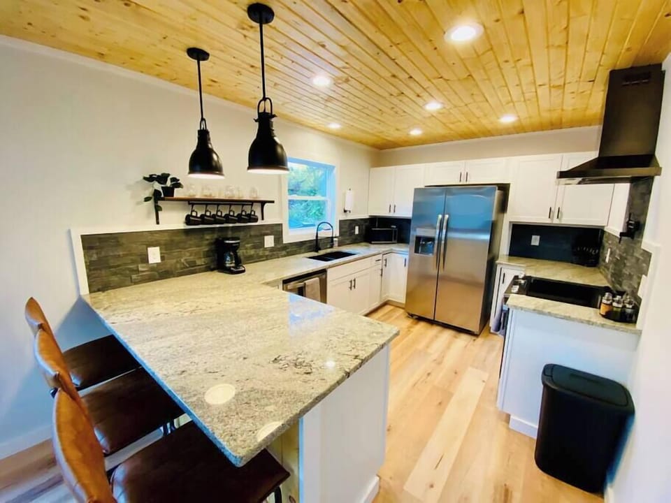 Fully stocked modern kitchen with breakfast bar