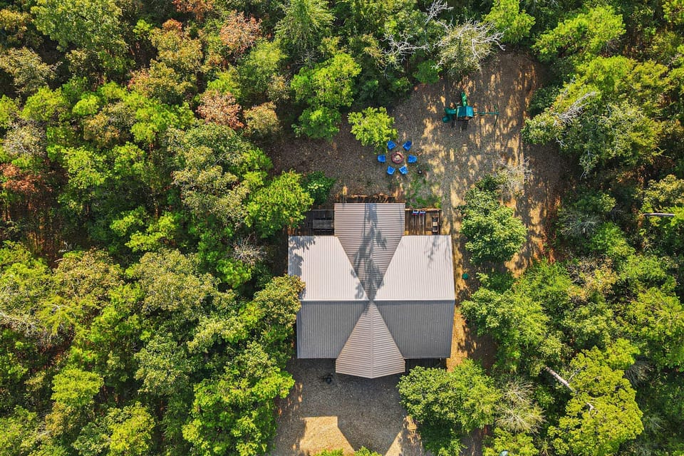 This charming cabin nestled among the trees offers a peaceful retreat from city life.
