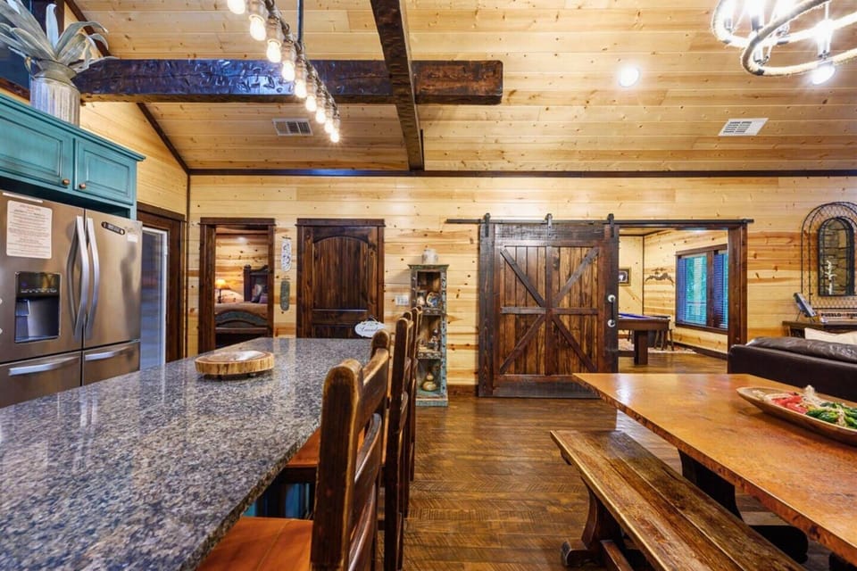 Whip up delicious meals in this stylish kitchen with its eye-catching teal cabinetry.