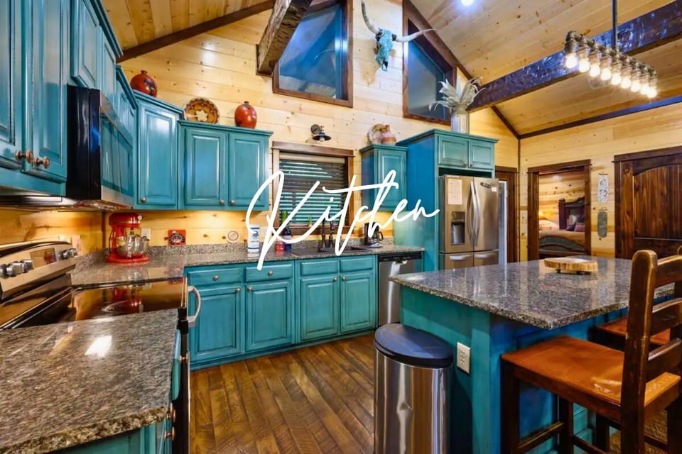 Step into this vibrant kitchen with bold teal cabinets and everything you need to cook up a storm.