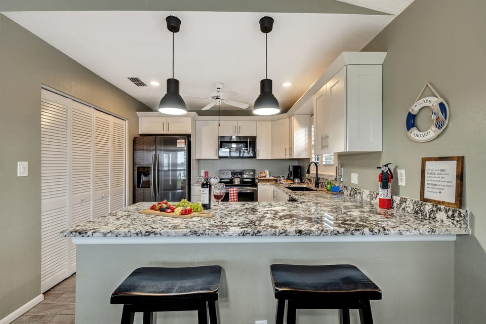 Embark on a culinary journey within the heart of our well-equipped kitchen, where an array of modern appliances awaits your culinary endeavors.