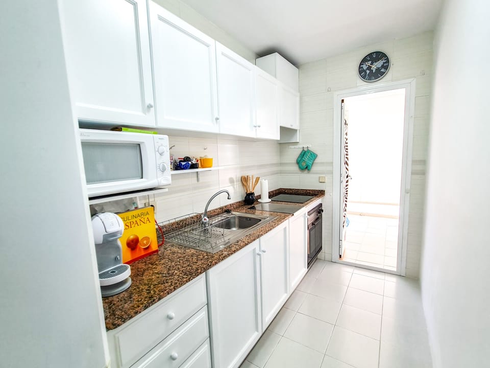 Separate kitchen with access to dining terrace