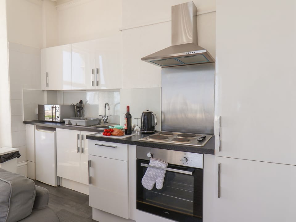 Fridge, electric kettle, toaster, cookware/dishes/utensils