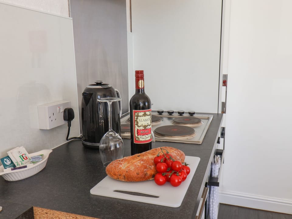 Fridge, electric kettle, toaster, cookware/dishes/utensils