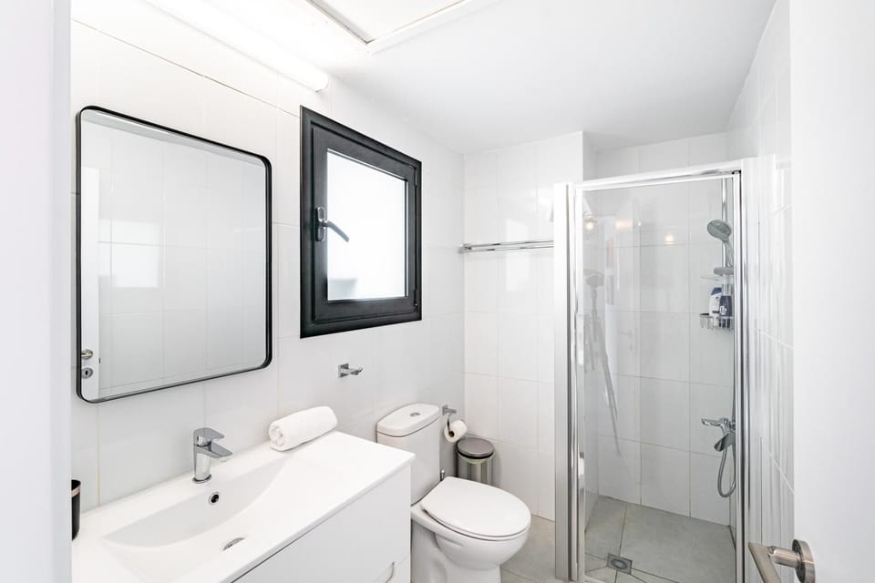 Shared bathroom with walk-in shower