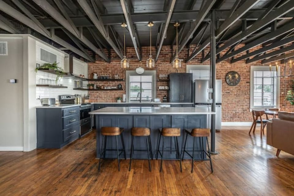 The open floor plan in the Common Area/Living Room includes the full kitchen.